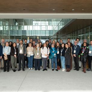 Group photo of a large group of people smiling.
