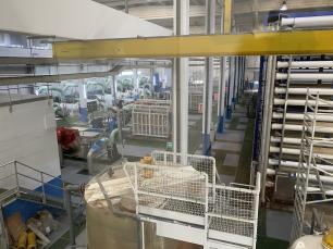 Industrial water treatment plant with tanks and pipes.