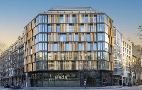 EADA Modern building with wooden facade, in an urban setting.