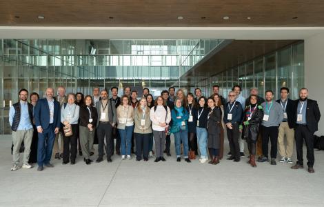 Group photo of a large group of people smiling.