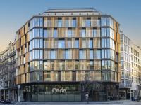 EADA Modern building with wooden facade, in an urban setting.