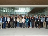 Group photo of a large group of people smiling.