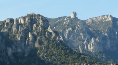 Mountain range under a clear blue sky.