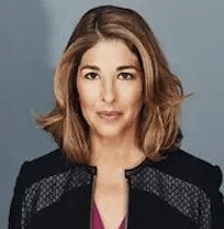 Photograph of a woman with fair skin, in a black jacket.xxx