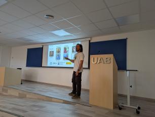 A man giving a presentation in a lecture hall.