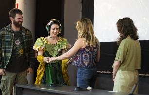 People shaking hands at an event.